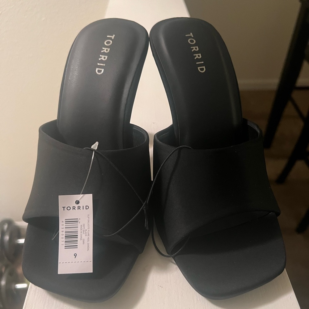 New, never worn. Torrid- black heeled slip on sandal